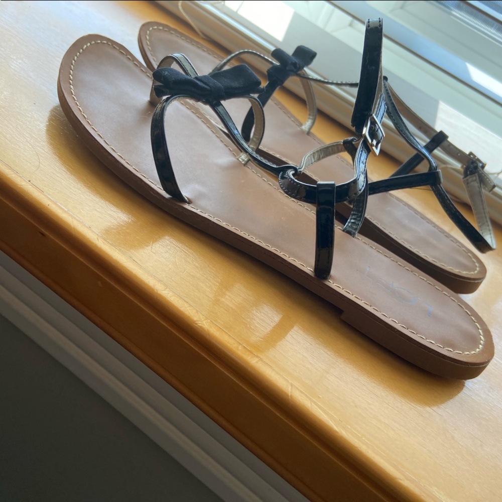 LOFT super cute & feminine black sandal.  Some wear reflective in price.